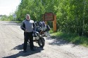 A couple, struggling with trying to get a picture in front of the sign, traded taking pictures