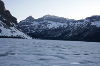 Usually a bright turquise, the late sun and lingering ice make this shot of Bow Lake  look more like winter than the beginning of June.