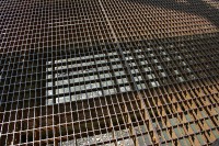 Most of the bridges along the Alaska Highway are surfaced with steel grate for drainage.  It makes the bike a little unstable when it is dry and it is very slick when wet.
