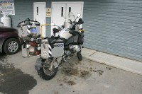 The bike was parked out to the side of the hotel.  I had removed everything but the two Touratech crash bar bags when I parked it for the night.  There wasn't much of anything in the bags, just some camp food, wipes, toilet paper and the like.  During the night some indigents ransacked the bags and took all of the food, the insect repellant and the toilet paper, but left everything else strewn over the parking lot.