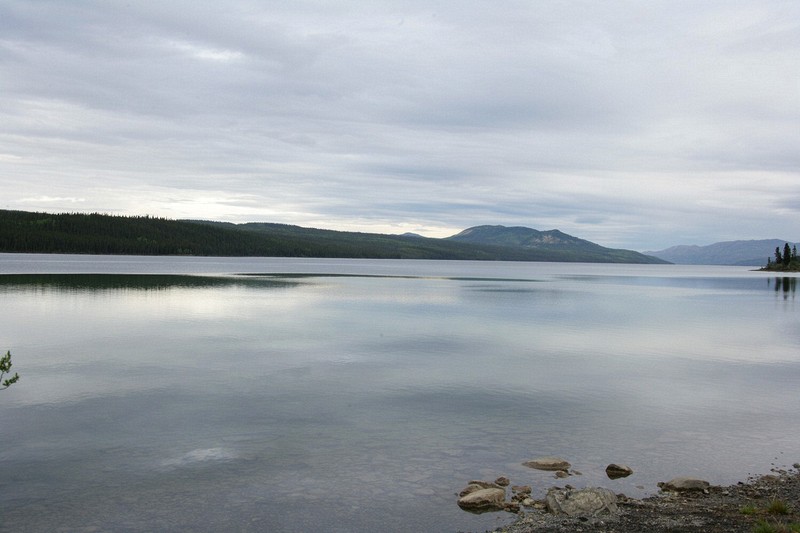 This is al lake along the Klondike Highway.  The clouds are growing and rain is threatening, but I should drive out of it just before Dawson