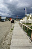 The whole town has dirt streets and what sidewalks they have are wooden.