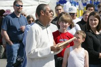 An audience member inspects the board