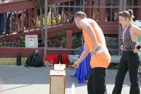 Her 'volunteer' assistant (clearly a plant) sets fire to the board