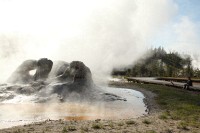 Walking around the geyser fields at Old Faithful - Michelle taking in the steam.